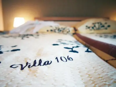 Łóżko lub łóżka w pokoju w obiekcie Villa 106