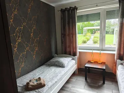 Łóżko lub łóżka w pokoju w obiekcie Villa 106