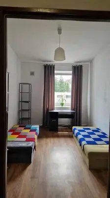 Łóżko lub łóżka w pokoju w obiekcie Noclegi krótkoterminowe