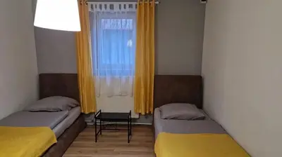 Łóżko lub łóżka w pokoju w obiekcie Noclegi krótkoterminowe