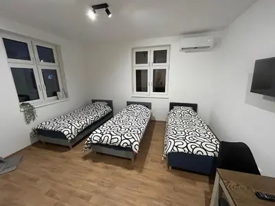 Łóżko lub łóżka w pokoju w obiekcie Apartamenty przy Galerii