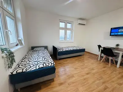 Łóżko lub łóżka w pokoju w obiekcie Apartamenty przy Galerii