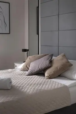 Łóżko lub łóżka w pokoju w obiekcie Apartament Avocado