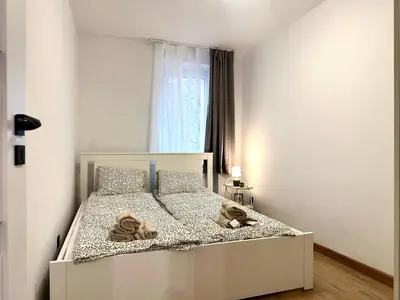 Łóżko lub łóżka w pokoju w obiekcie Grabiszyńska Apartment - Lift