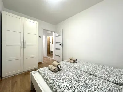 Łóżko lub łóżka w pokoju w obiekcie Grabiszyńska Apartment - Lift