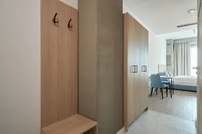 Łóżko lub łóżka w pokoju w obiekcie Aparthotel Symphony Krakowska 35