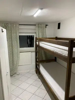 Łóżko lub łóżka w pokoju w obiekcie NOMAD Hostel