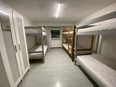 Łóżko lub łóżka w pokoju w obiekcie NOMAD Hostel