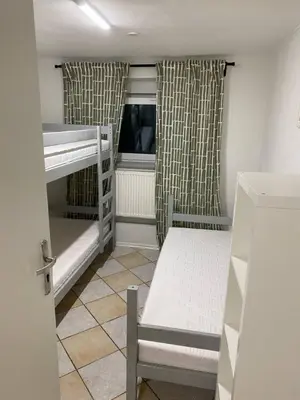 Łóżko lub łóżka w pokoju w obiekcie NOMAD Hostel