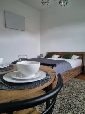Łóżko lub łóżka w pokoju w obiekcie Apartament KB