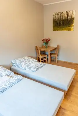 Łóżko lub łóżka w pokoju w obiekcie Noclegi GCK Biała