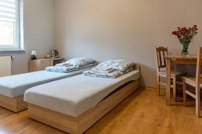 Łóżko lub łóżka w pokoju w obiekcie Noclegi GCK Biała