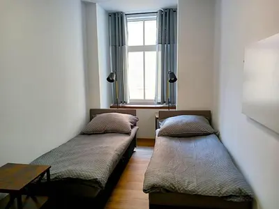 Łóżko lub łóżka w pokoju w obiekcie Apartament na Rynku