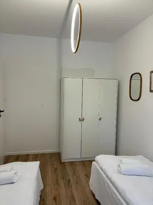 Łóżko lub łóżka w pokoju w obiekcie Apartament Grafitowy