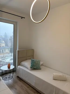 Łóżko lub łóżka w pokoju w obiekcie Apartament Morski