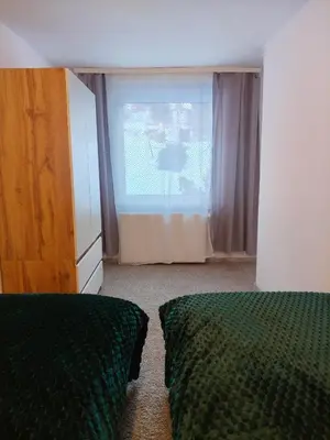 Łóżko lub łóżka w pokoju w obiekcie Apartament z ogrodem Poranna Rosa