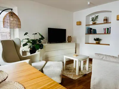 Telewizja i/lub zestaw kina domowego w obiekcie Słoneczny apartament z sauną