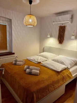 Łóżko lub łóżka w pokoju w obiekcie Słoneczny apartament z sauną