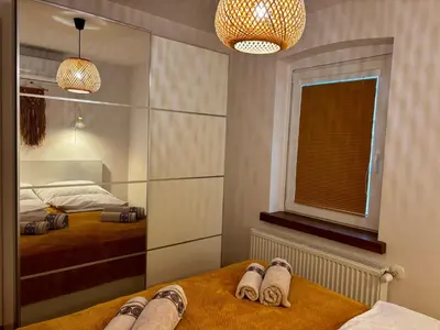 Łóżko lub łóżka w pokoju w obiekcie Słoneczny apartament z sauną