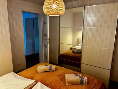 Łóżko lub łóżka w pokoju w obiekcie Słoneczny apartament z sauną