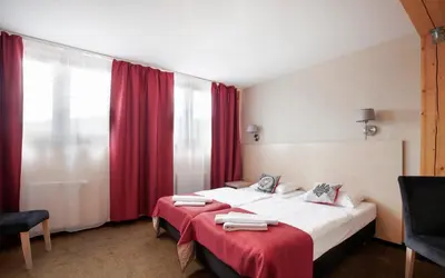 Łóżko lub łóżka w pokoju w obiekcie Karczma Czarna Góra - Czarna Góra Resort