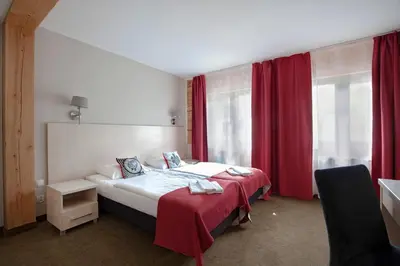 Łóżko lub łóżka w pokoju w obiekcie Karczma Czarna Góra - Czarna Góra Resort