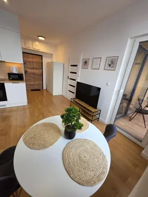 Telewizja i/lub zestaw kina domowego w obiekcie Horyzont Apartments