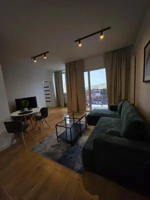Telewizja i/lub zestaw kina domowego w obiekcie Horyzont Apartments