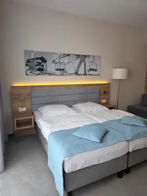 Łóżko lub łóżka w pokoju w obiekcie Aparthotel Apartamenty Czarna Góra 110