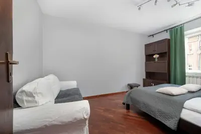 Łóżko lub łóżka w pokoju w obiekcie Atmospheric 2-Bedroom Apartment Near the Market Square by Noclegi Renters