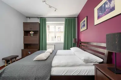 Łóżko lub łóżka w pokoju w obiekcie Atmospheric 2-Bedroom Apartment Near the Market Square by Noclegi Renters
