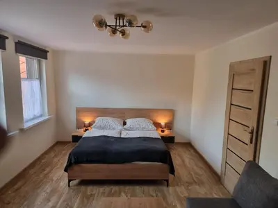 Łóżko lub łóżka w pokoju w obiekcie Apartament 5- Bliżej Zdroju