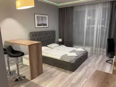 Łóżko lub łóżka w pokoju w obiekcie Apartament OVO 428