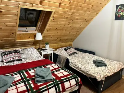 Łóżko lub łóżka w pokoju w obiekcie Górska Chata w Górach Bystrzyckich