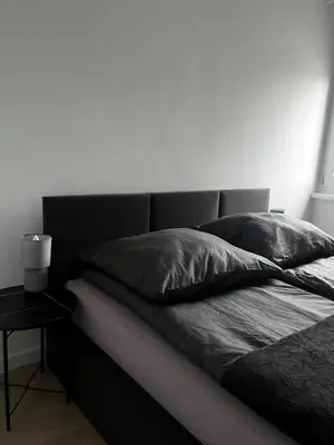Łóżko lub łóżka w pokoju w obiekcie Apartament Rynek Strzelin