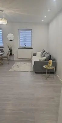 Łóżko lub łóżka w pokoju w obiekcie Apartament Piłsudskiego