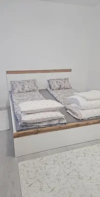 Łóżko lub łóżka w pokoju w obiekcie Apartament Piłsudskiego