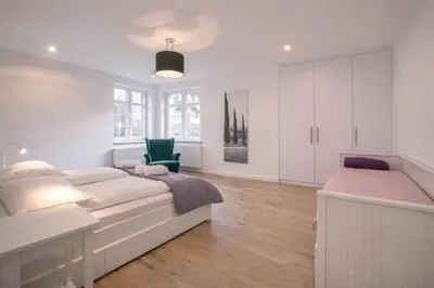 Łóżko lub łóżka w pokoju w obiekcie Apartament Warszawska 11