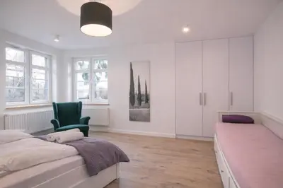 Łóżko lub łóżka w pokoju w obiekcie Apartament Warszawska 11