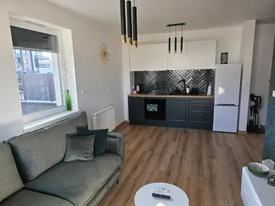 Telewizja i/lub zestaw kina domowego w obiekcie Apartament Podmiejska Nova