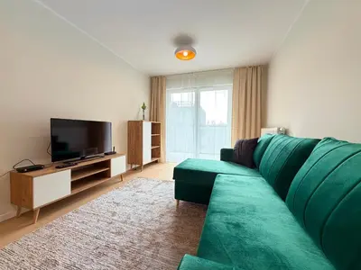 Telewizja i/lub zestaw kina domowego w obiekcie Madalińskiego Cosy Apartment by BookingHost