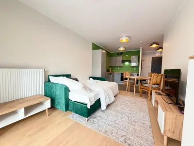 Łóżko lub łóżka w pokoju w obiekcie Madalińskiego Cosy Apartment by BookingHost