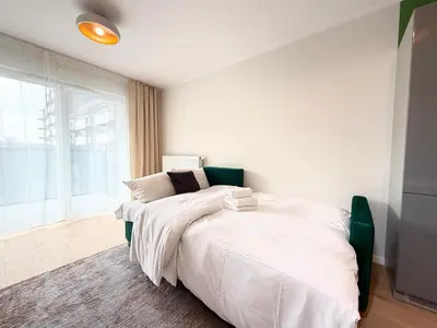 Łóżko lub łóżka w pokoju w obiekcie Madalińskiego Cosy Apartment by BookingHost