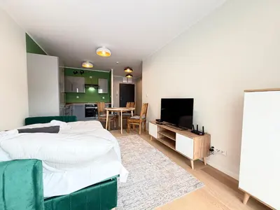 Telewizja i/lub zestaw kina domowego w obiekcie Madalińskiego Cosy Apartment by BookingHost