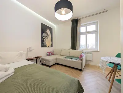 Część wypoczynkowa w obiekcie Rozbrat Green Point Apartment by BookingHost