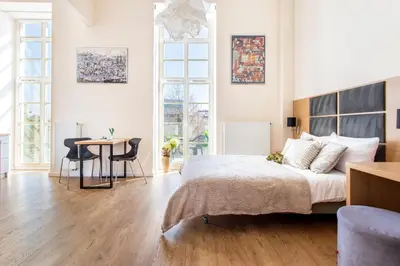 Łóżko lub łóżka w pokoju w obiekcie Apartamenty RentToGo - Bulwar Staromiejski