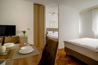 Łóżko lub łóżka w pokoju w obiekcie RentPlanet - Studio Pereca