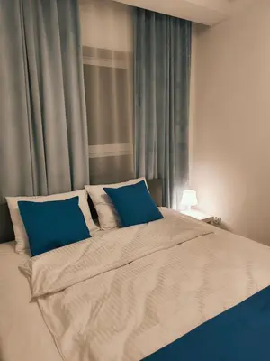 Łóżko lub łóżka w pokoju w obiekcie Aura Apartamenty 3