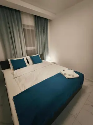 Łóżko lub łóżka w pokoju w obiekcie Aura Apartamenty 3