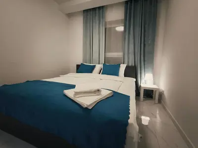 Łóżko lub łóżka w pokoju w obiekcie Aura Apartamenty 3